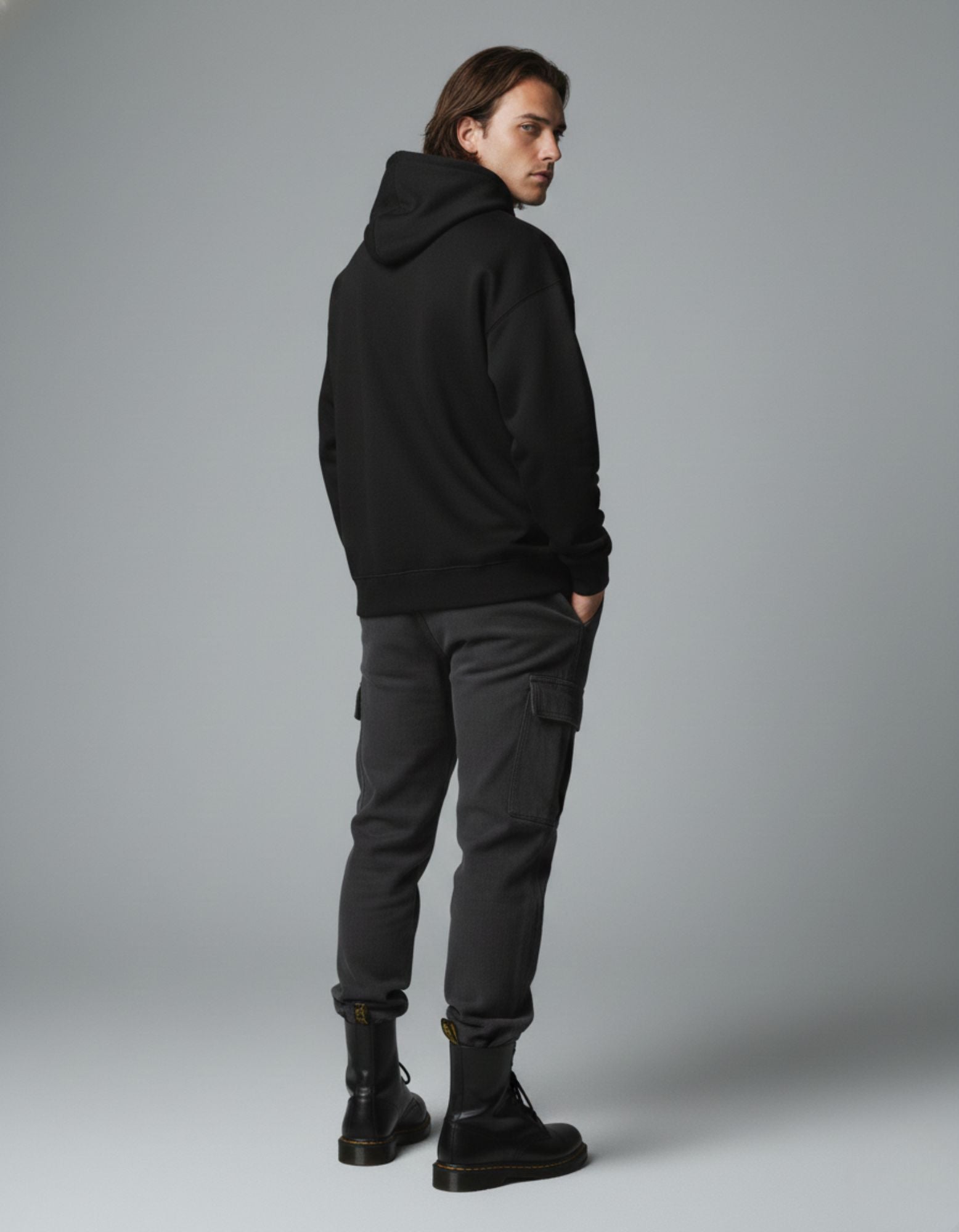 Back view of black oversized hoodie showing clean plain back design
