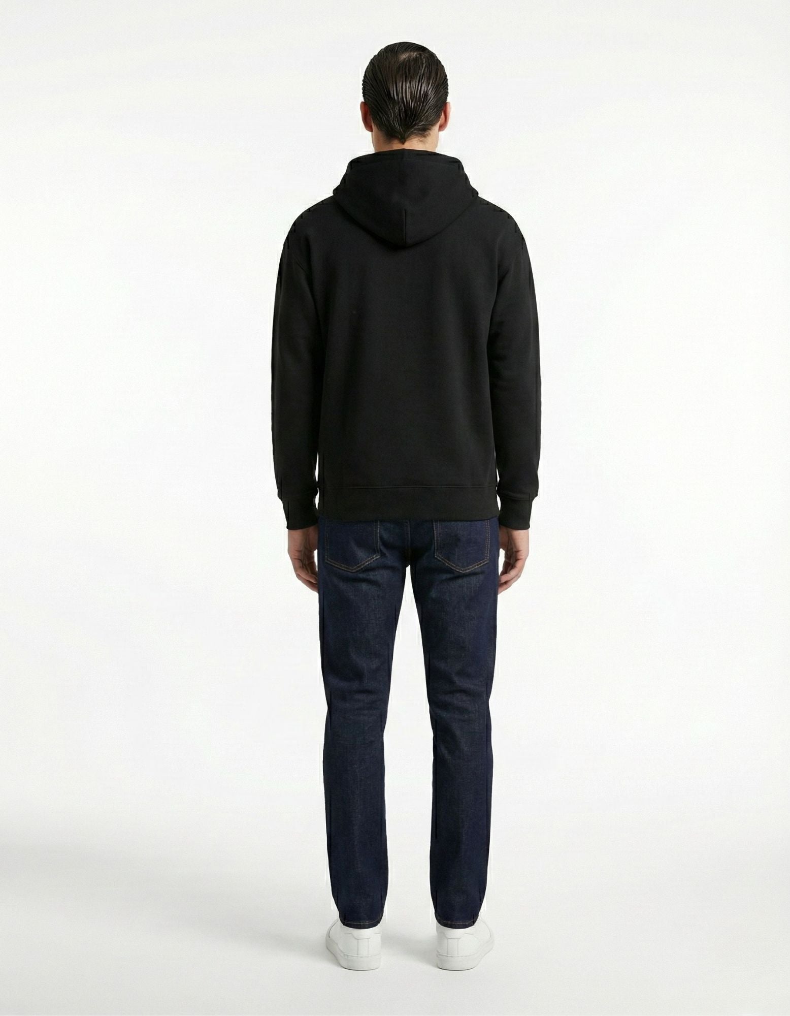 Back view of black oversized hoodie with clean plain back design