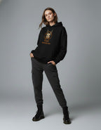 Front view of black oversized hoodie with graphic print worn by female model