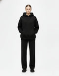 Front view of black oversized hoodie with clean minimalist look