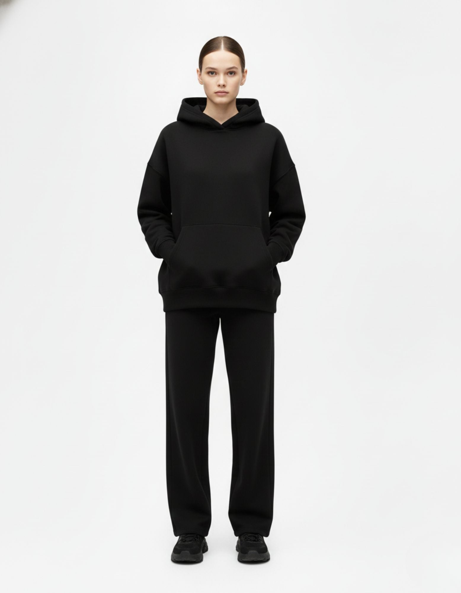 Front view of black oversized hoodie with clean minimalist look