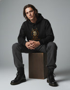 Black oversized hoodie with Alice Borderland graphic worn by male model sitting pose