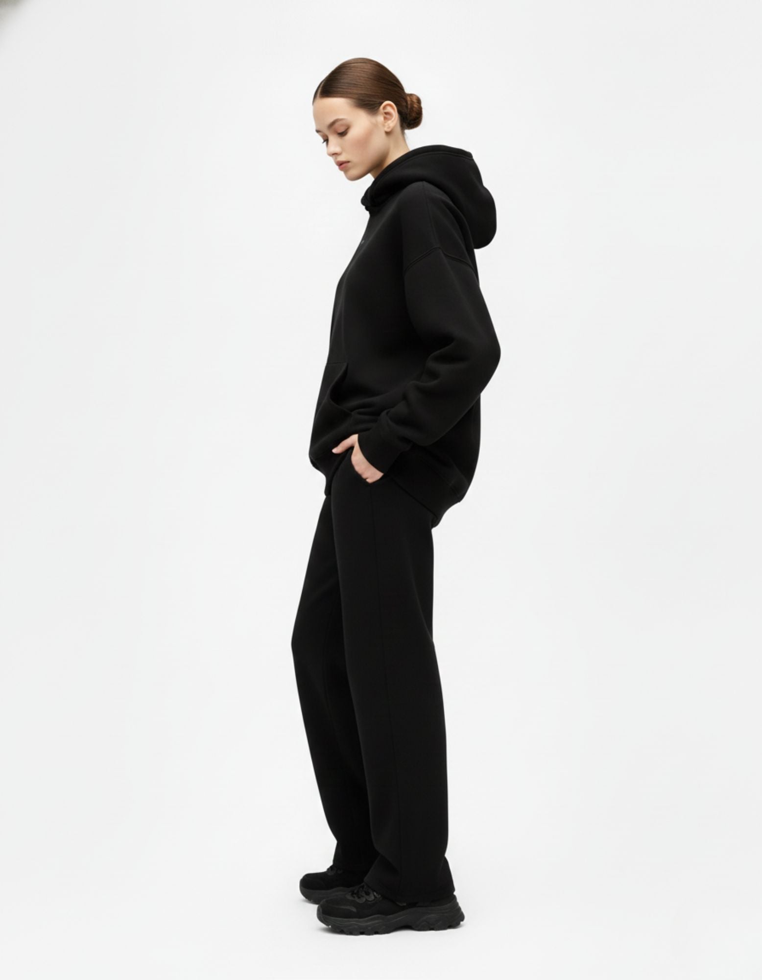 Black oversized hoodie side profile with drop shoulder fit