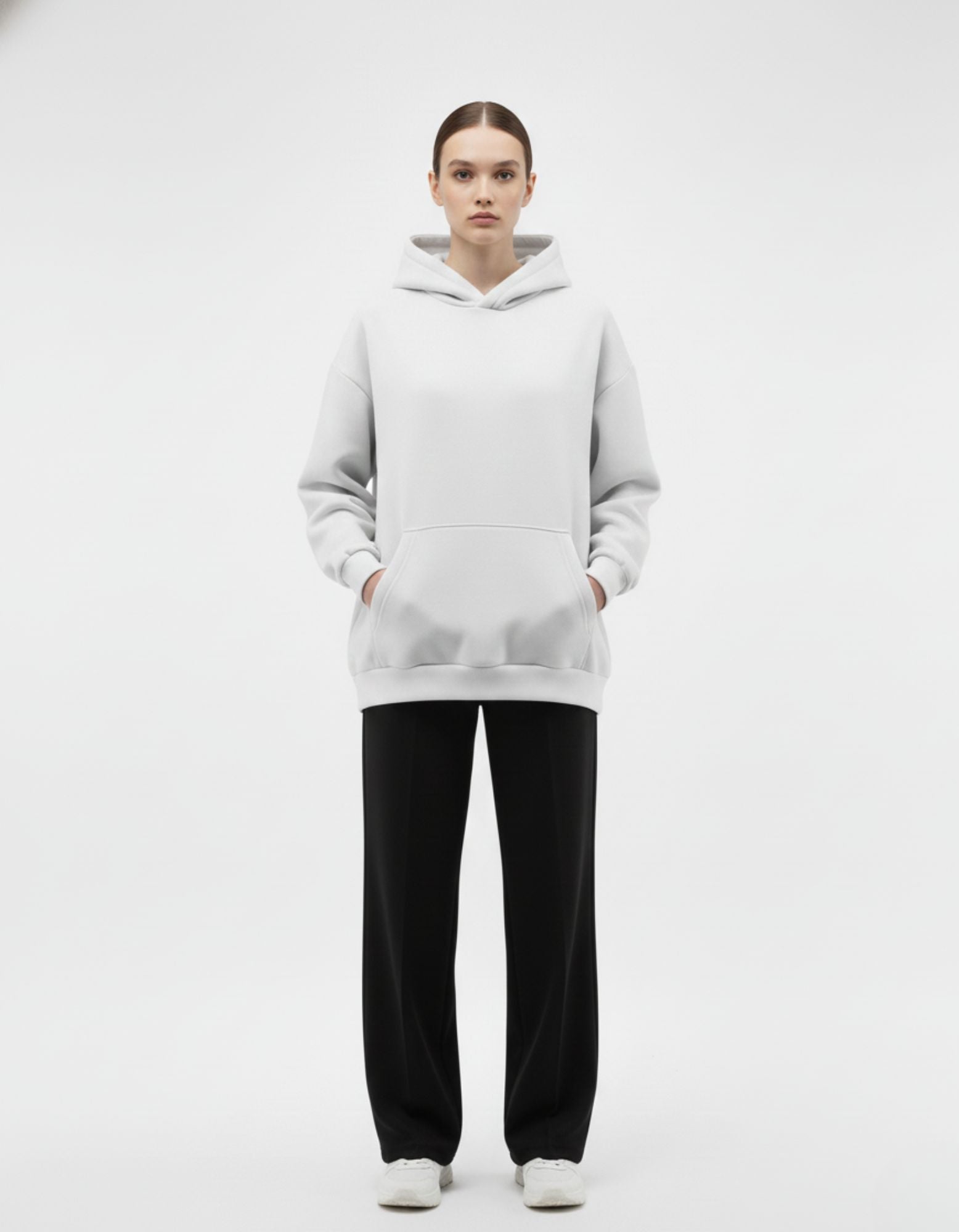 Front view of light grey oversized hoodie with clean minimalist front

