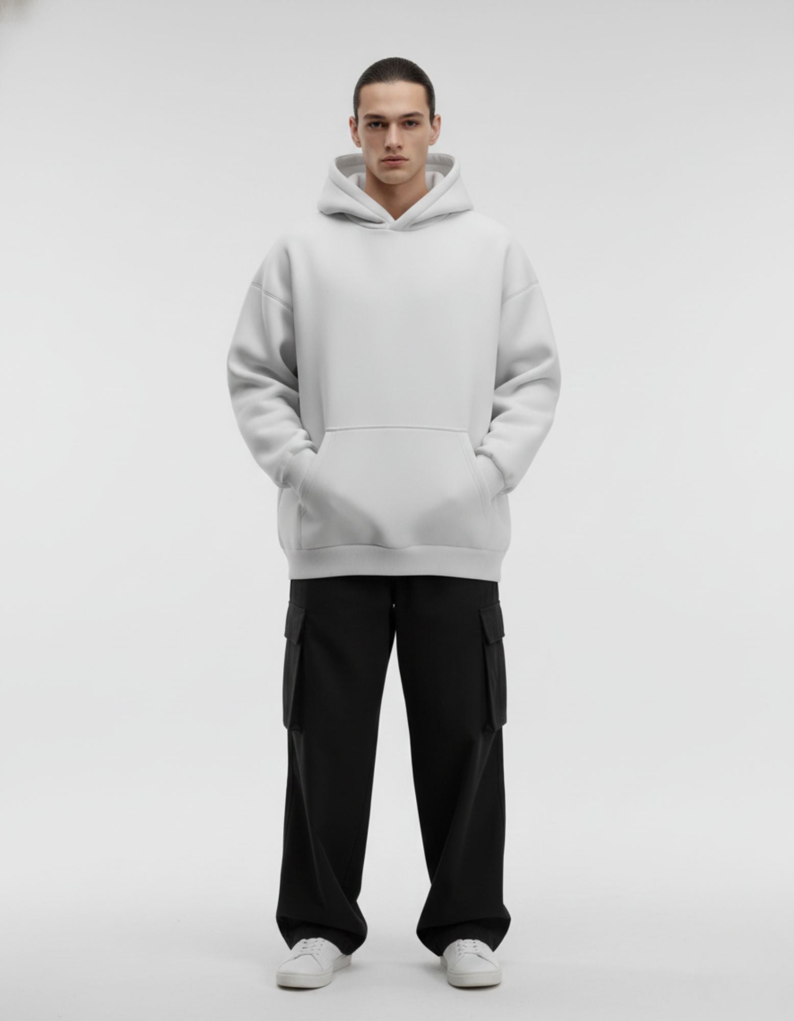 Front view of light grey oversized hoodie with clean minimalist front
