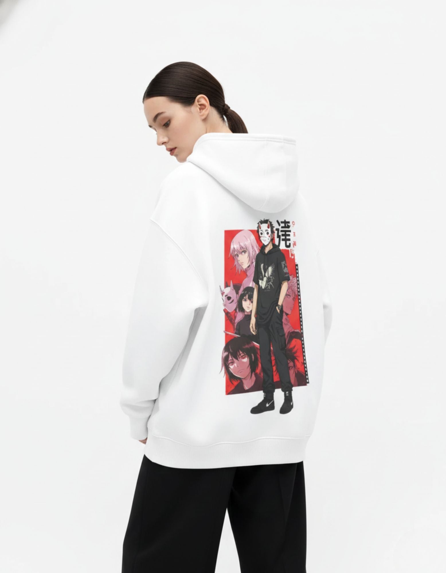Back view of white oversized hoodie with anime graphic worn by female model