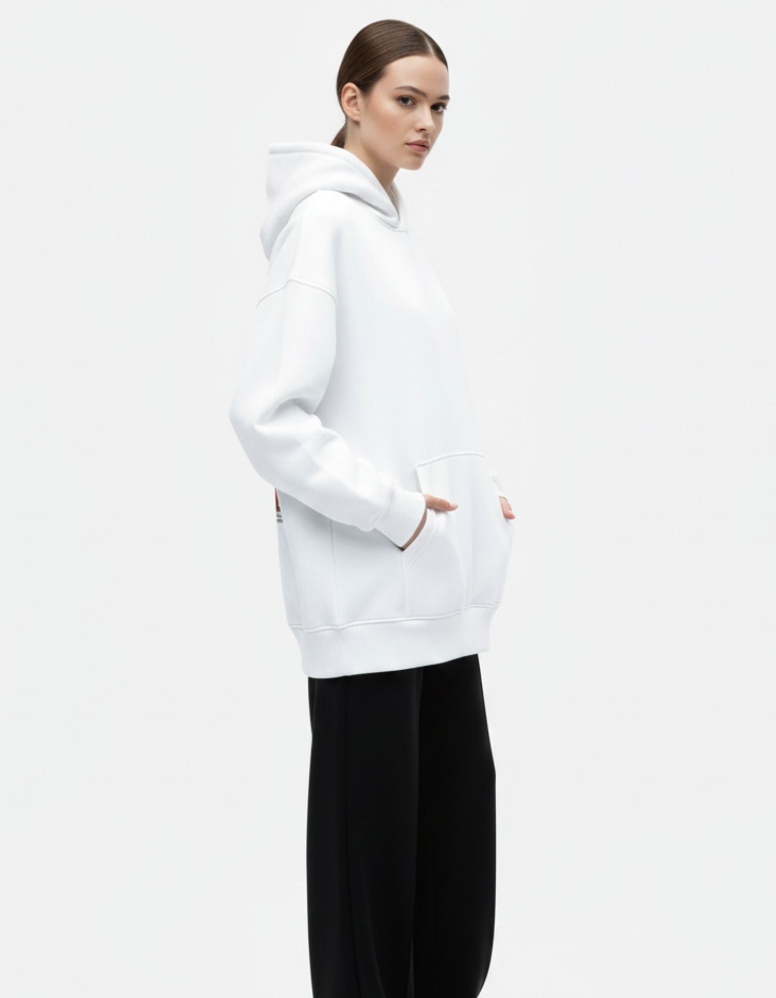 Side pose of white oversized hoodie with relaxed oversized fit
