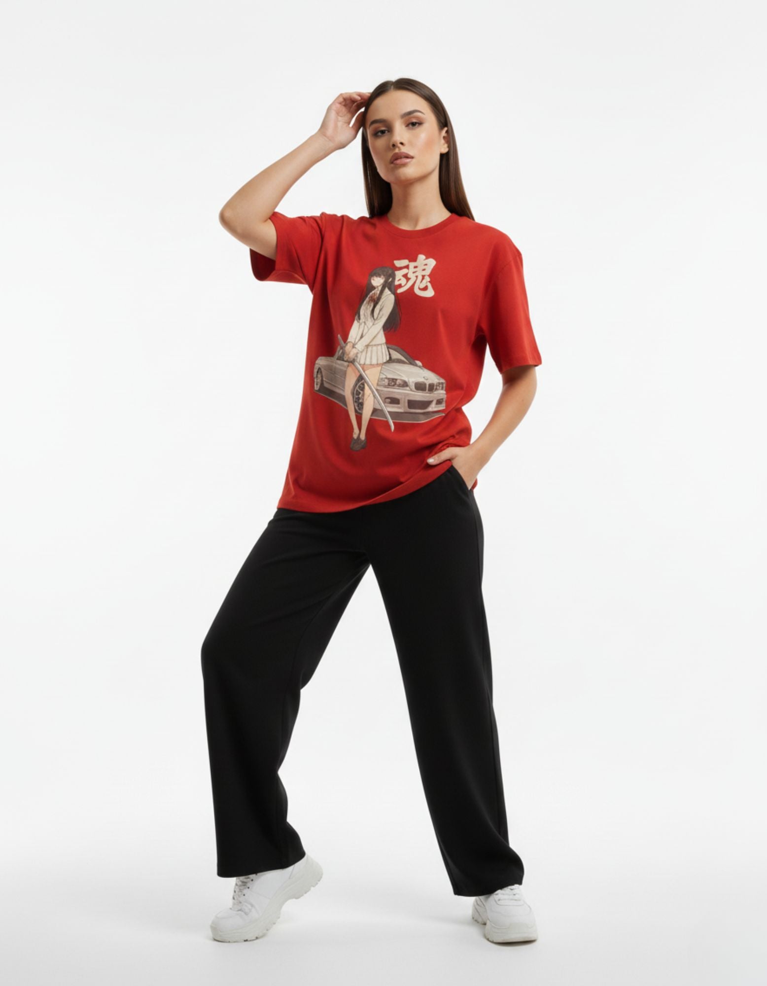Model wearing the oversized red anime girl t-shirt, demonstrating a casual and trendy aesthetic for 2025 fashion.