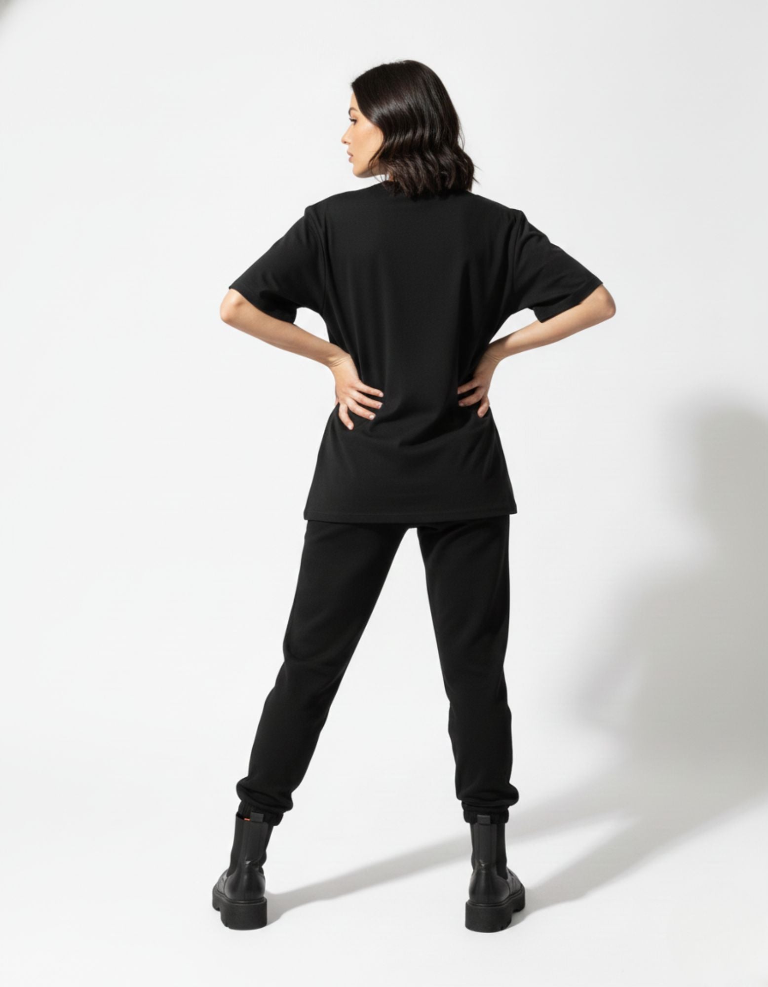 Back view of a plain black oversized heavyweight t-shirt from the GENZs Fashion essentials collection.