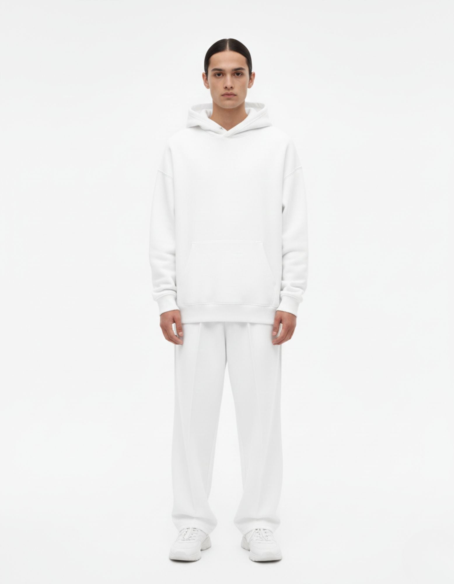 Front standing view of a male model in a high-quality white heavyweight hoodie, a versatile base for anime-themed outfits.