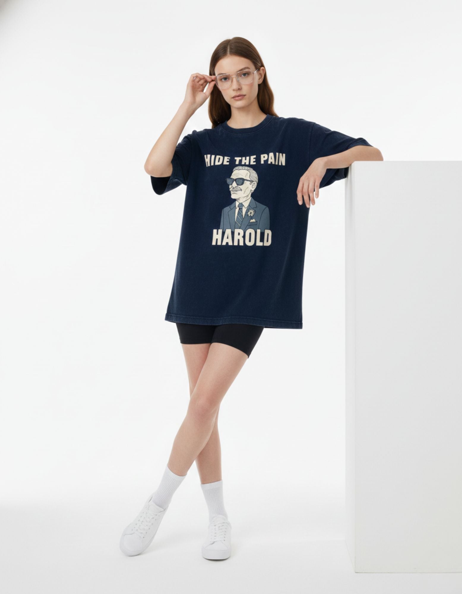 Woman posing in Hide the Pain Harold pop culture oversized t-shirt.