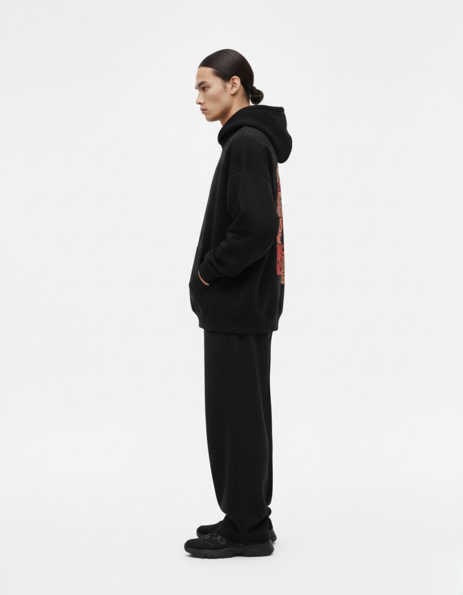 Side profile of a premium black fleece hoodie by GENZs Fashion, highlighting the comfortable oversized drop-shoulder fit.