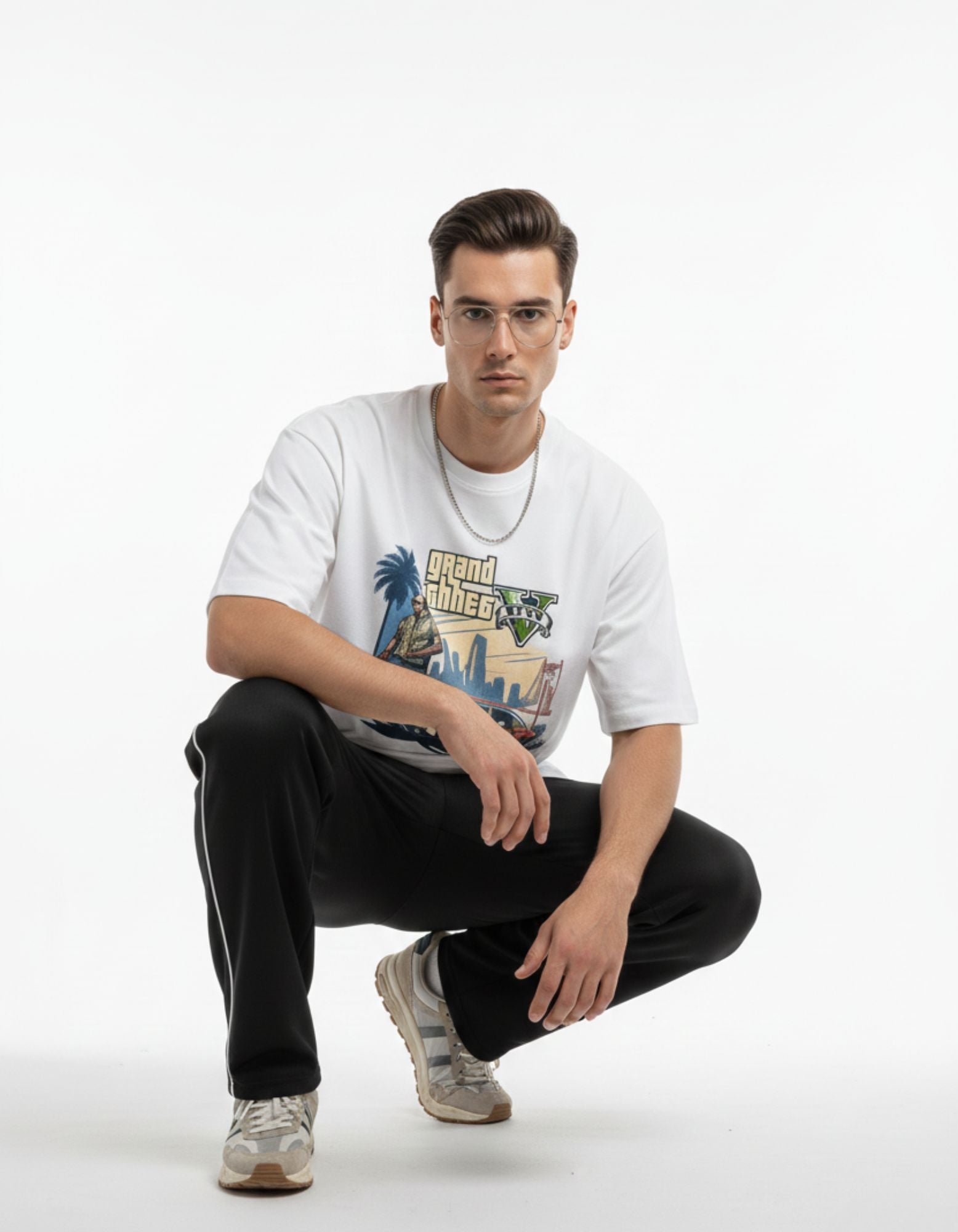 Man in white oversized gaming graphic t-shirt, relaxed streetwear aesthetic for Indian market.