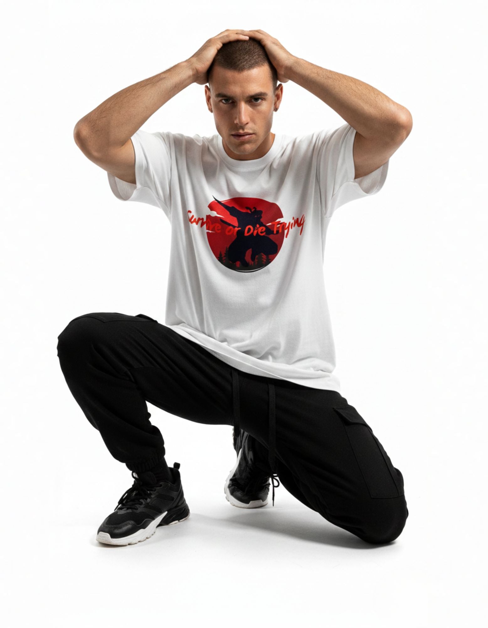 Man posing in white oversized samurai graphic t-shirt, "Survive or Die Trying" slogan tee for 2025 India fashion.