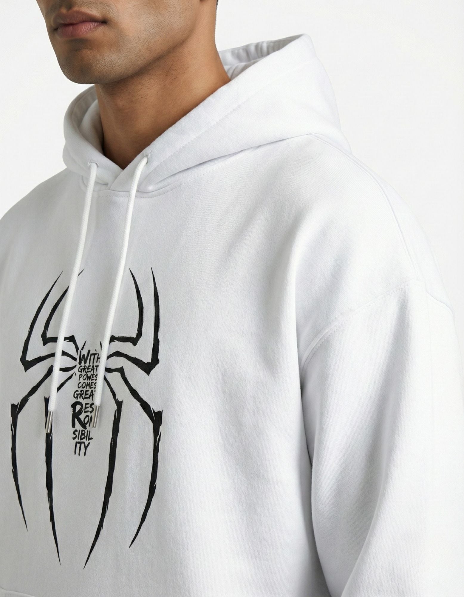 High-quality detail of the "With Great Power" spider graphic print on a white heavy cotton hoodie.