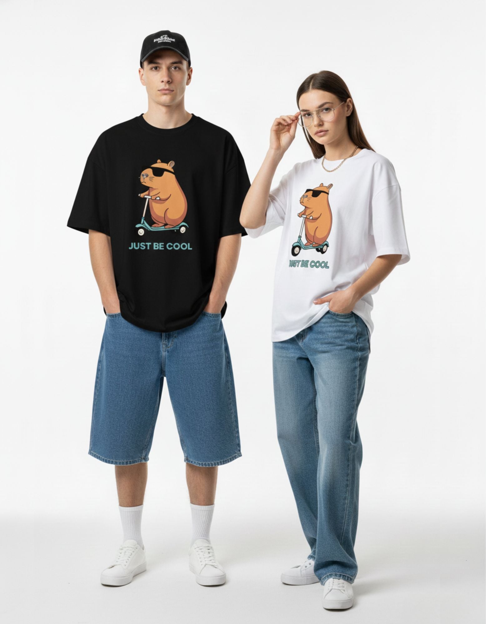A male model wearing a premium white streetwear t-shirt with a "Just Be Cool" capybara print, focused on the Indian market.