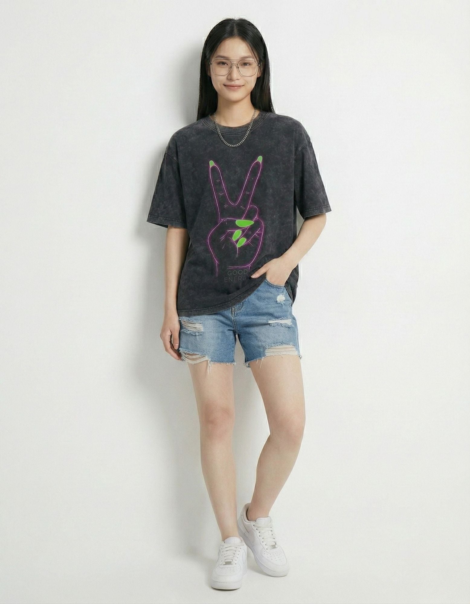 "Full body shot of the 'Good Energy' charcoal acid wash graphic tee, a staple for modern streetwear collections."