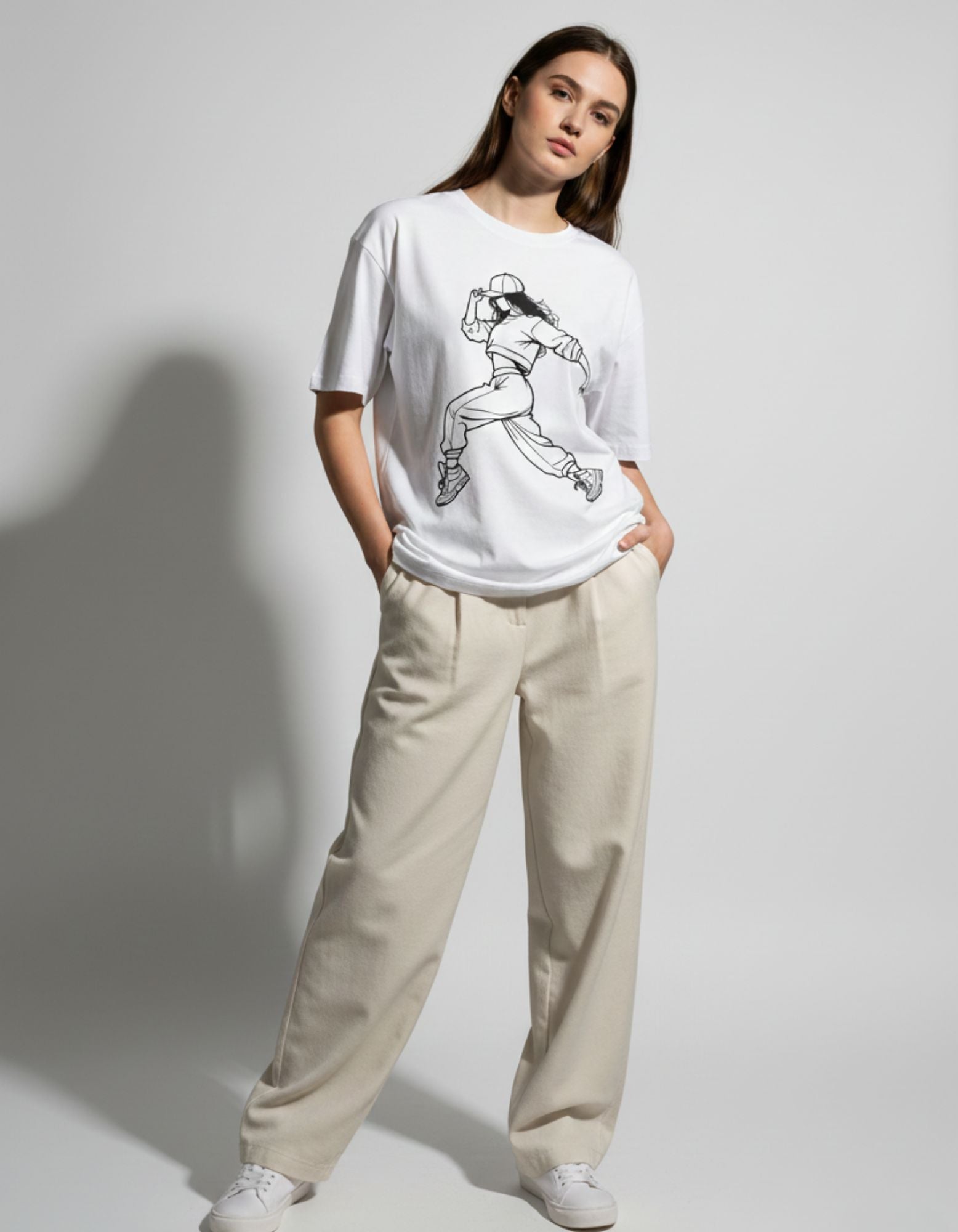 Female model wearing a GENZs Fashion white baggy t-shirt with anime graphic, styled with beige cargo pants.