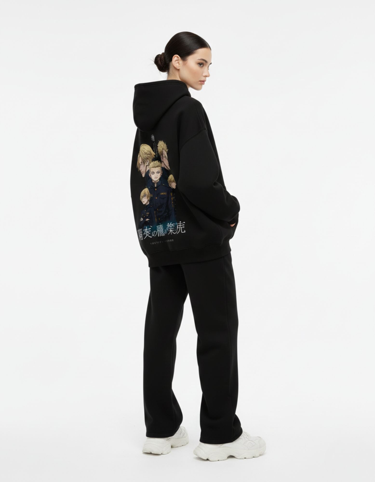 Female model showcasing the detailed manga-style character graphic on the back of a black GENZs Fashion hoodie.