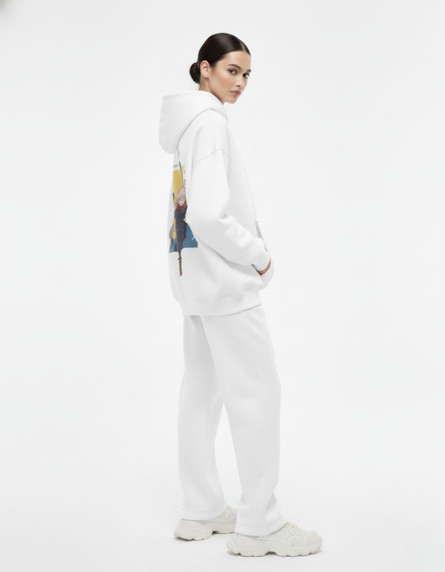 Back view of a female model in a GENZs Fashion white hoodie with a large Jujutsu Kaisen graphic, perfect for anime fans looking for stylish merch.