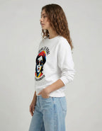 Side profile of a model wearing the 'VIVA LA VIDA' graphic sweatshirt and light-wash baggy jeans, showcasing a 2025 Gen Z silhouette.