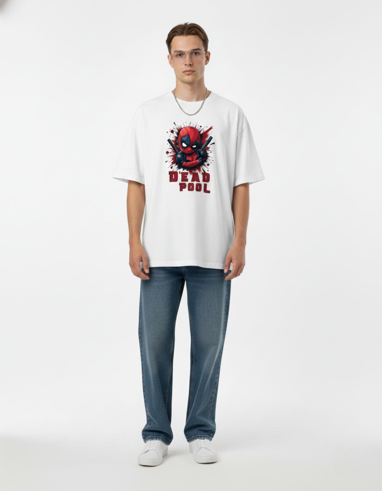Full body shot of man in white Deadpool printed oversized tee, styled for a casual and trendy Indian streetwear vibe.