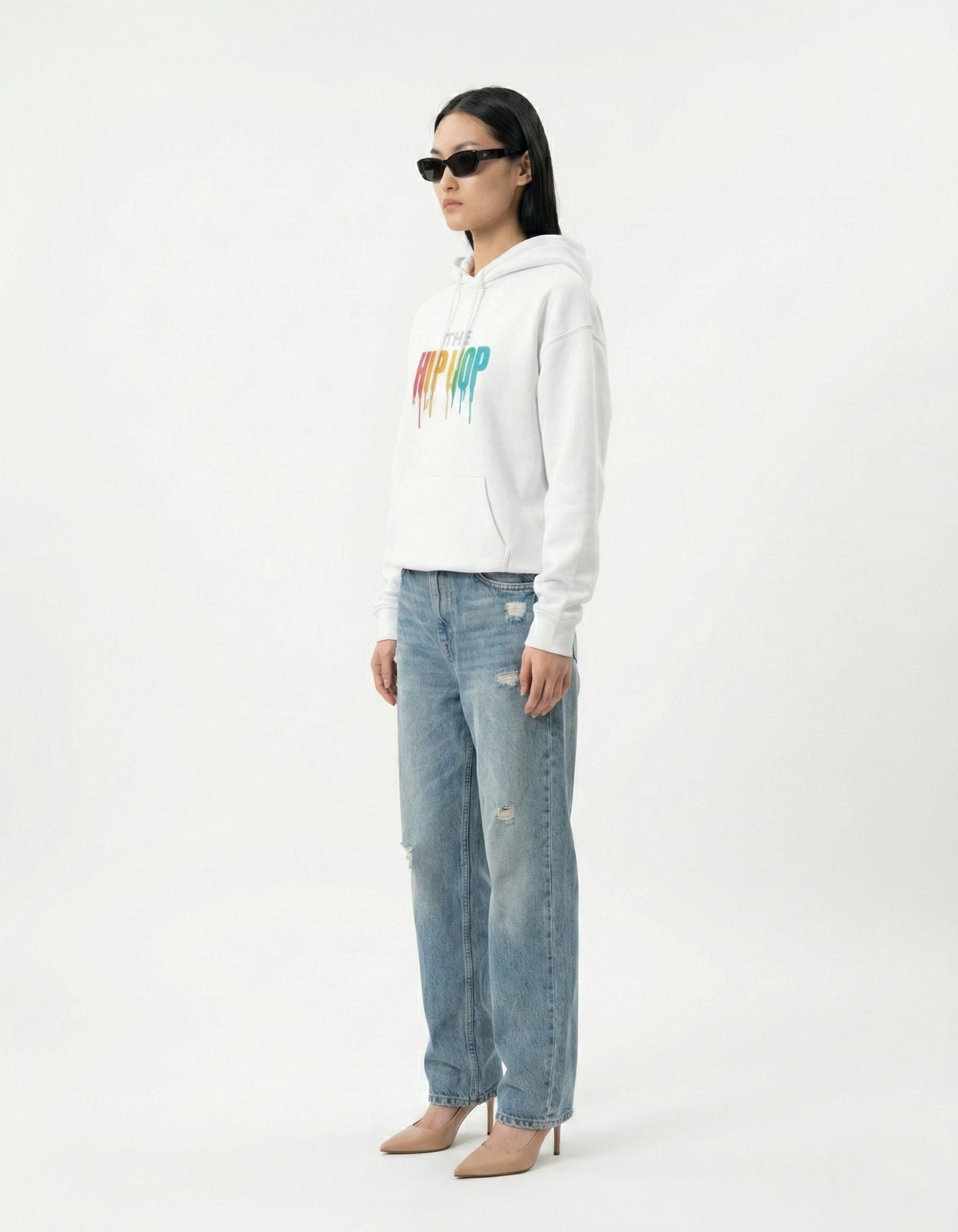 Side view of a white unisex hoodie with a high-quality cotton finish and comfortable streetwear silhouette.