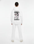 Back view of a white oversized hoodie with a bold "NOCHJA FAIR21" graphic print of a girl in sunglasses.
