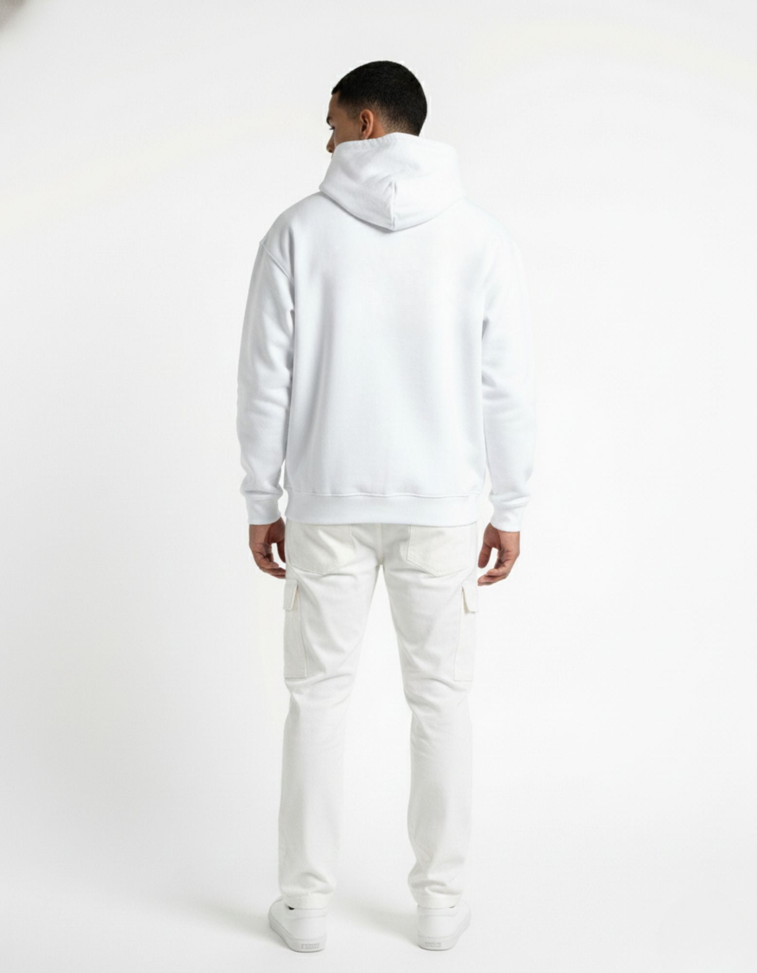 Back view of a man wearing an oversized white hoodie from GENZs Fashion, showing the relaxed fit and premium fabric drape.