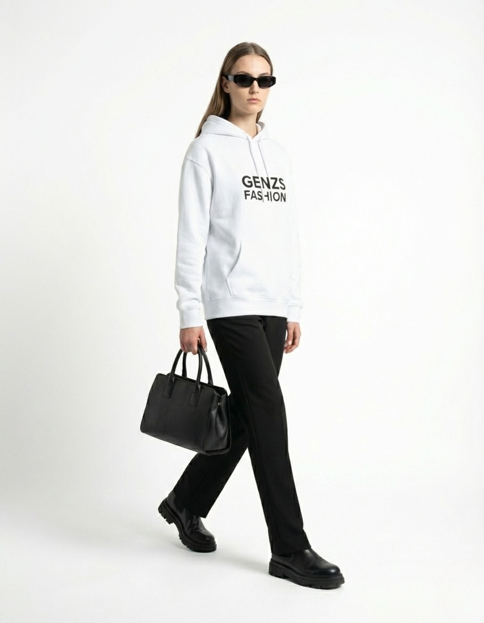 Back view of a premium white heavy-weight hoodie on a male model, styled with white trousers.