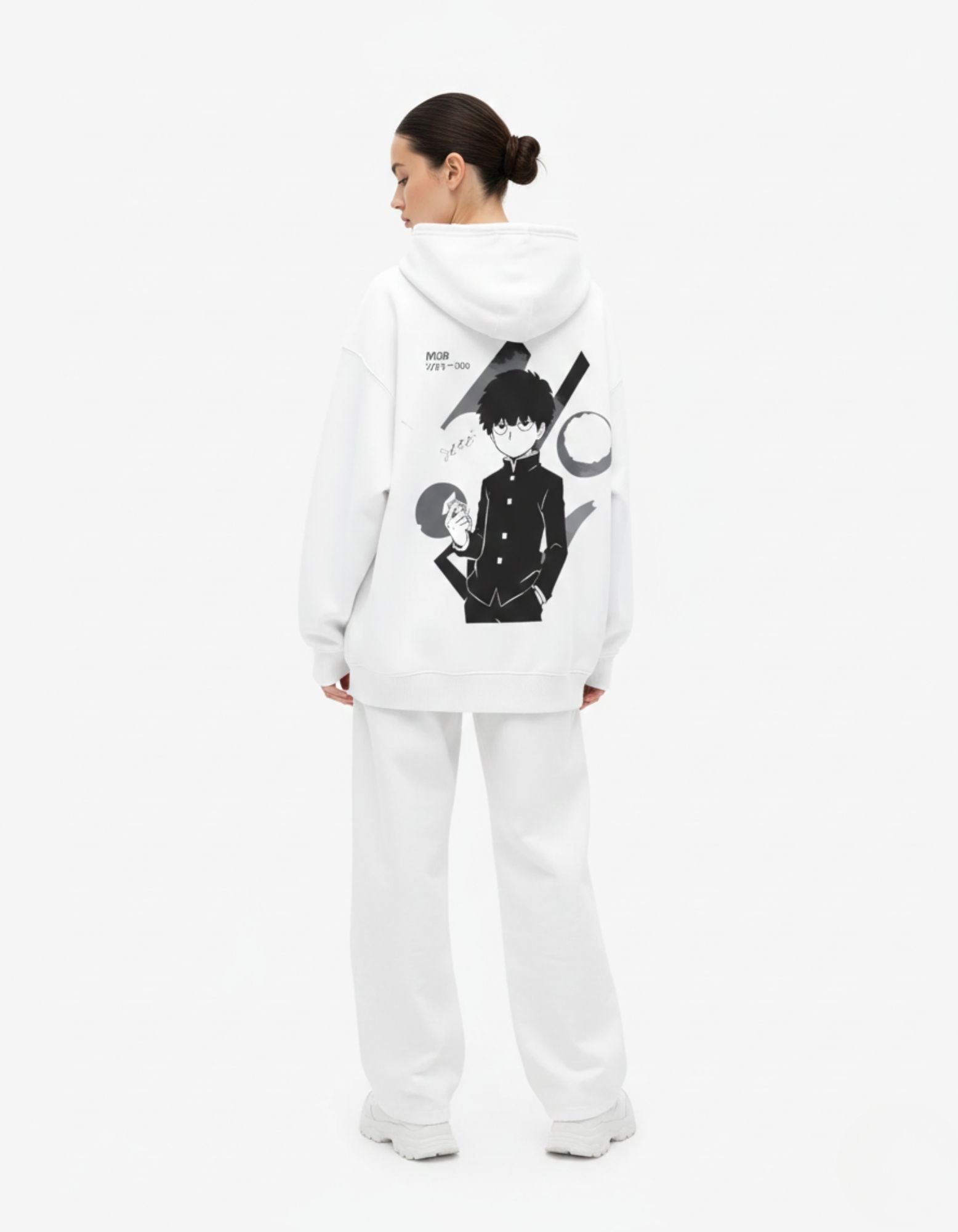 Female model showcasing the full back graphic of a white Mob Psycho 100 anime hoodie by GENZs Fashion.