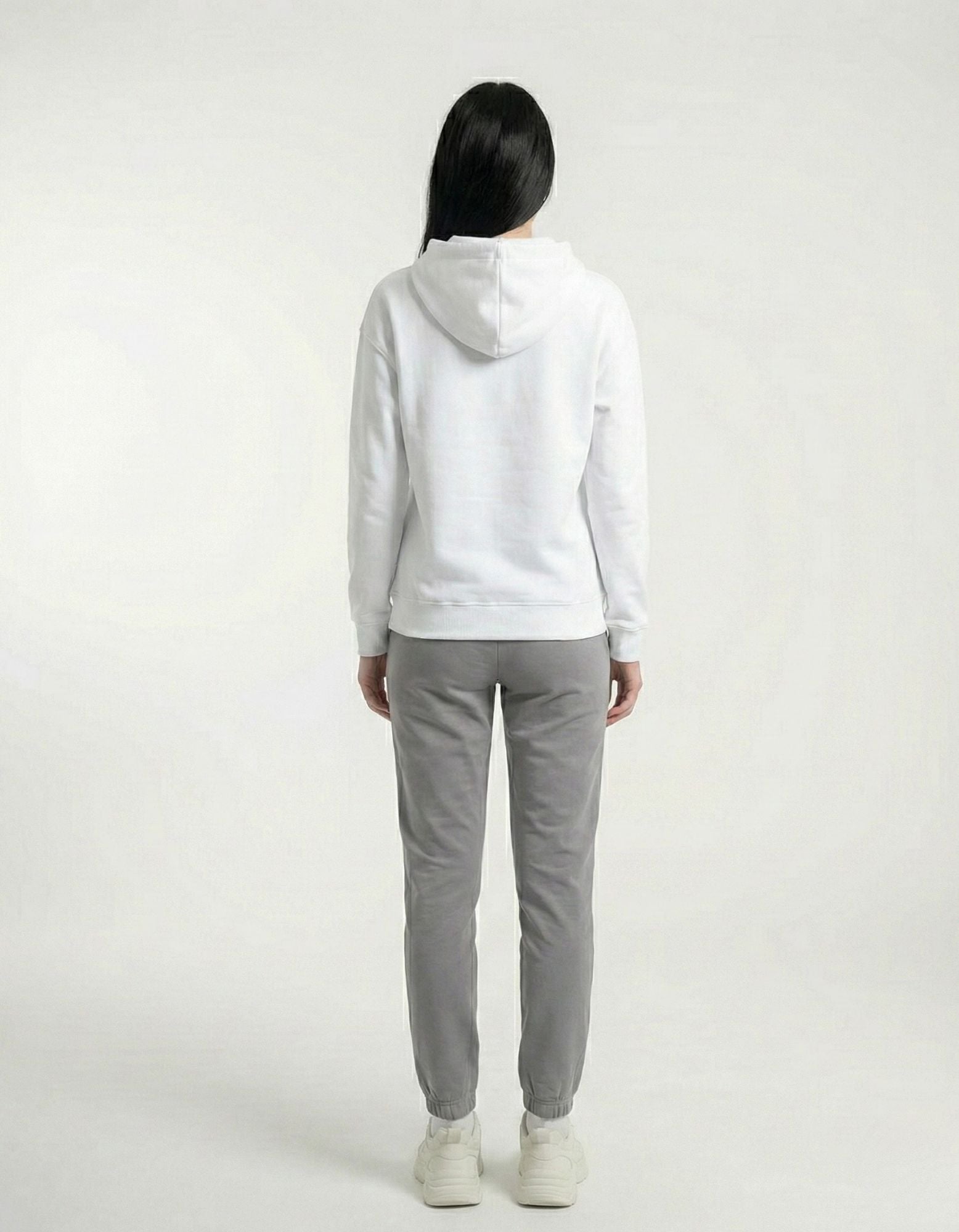 Back view of white oversized hoodie with clean plain back
