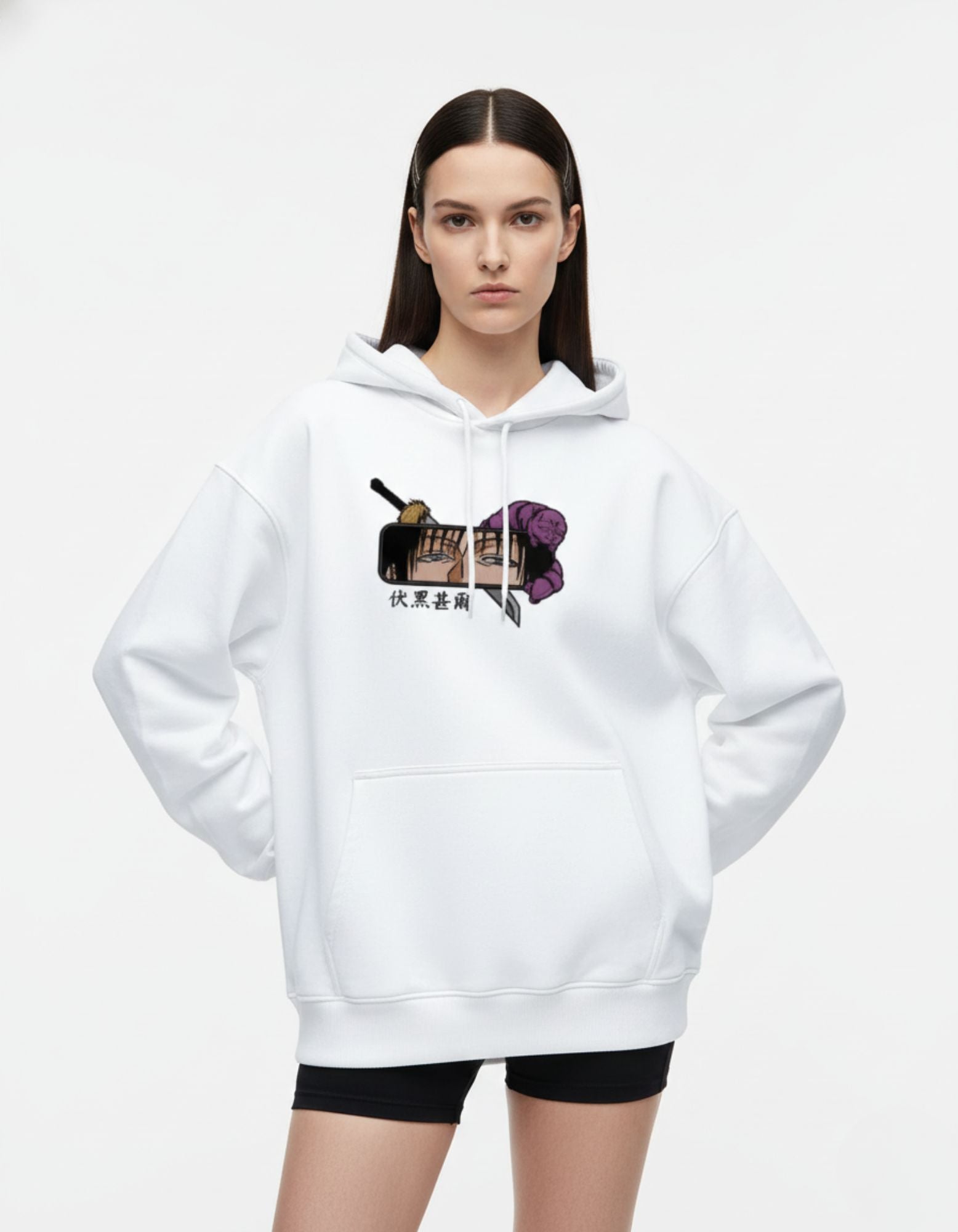 Front fashion pose of white oversized hoodie styled by female model
