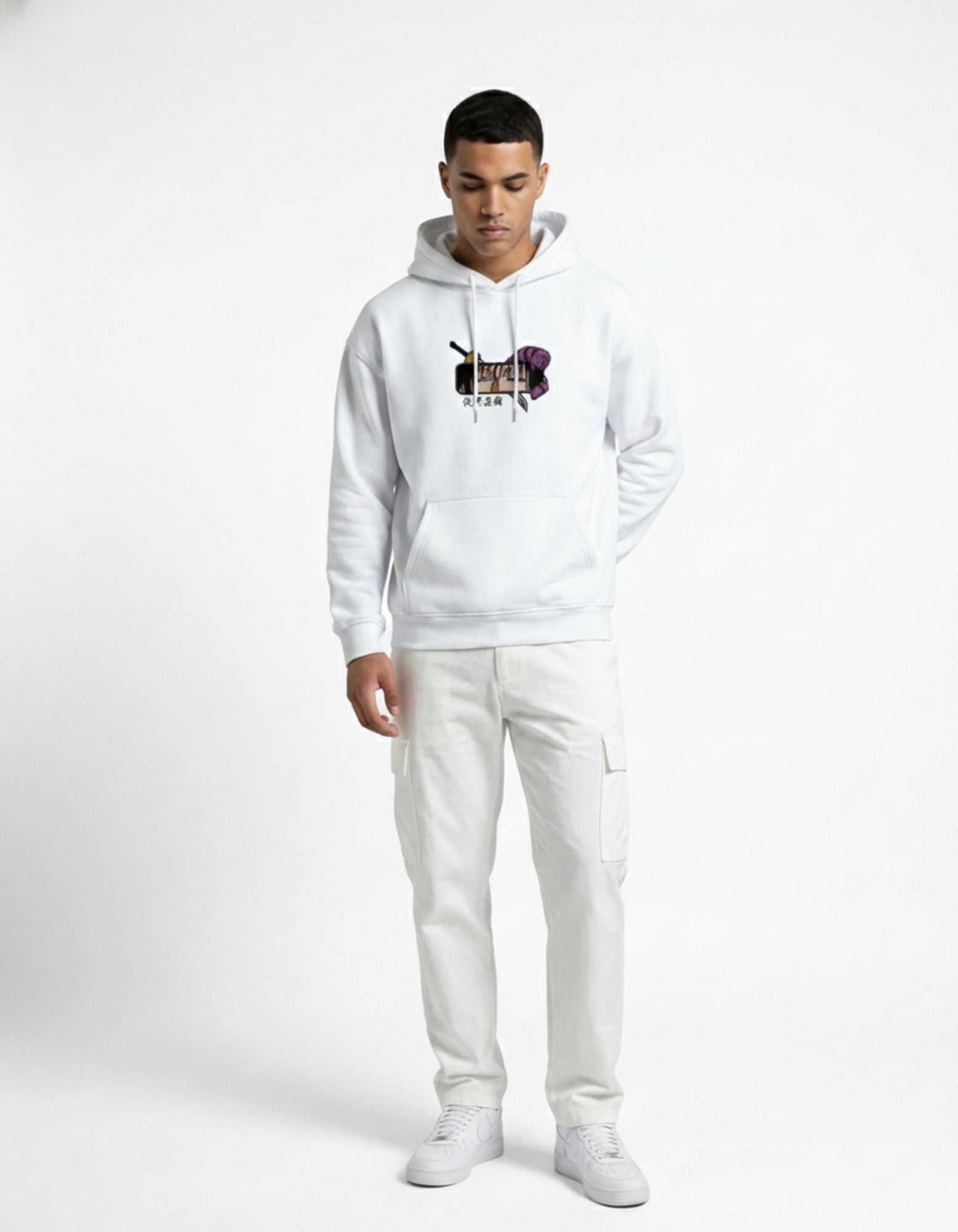 Full body view of white oversized hoodie worn by male model
