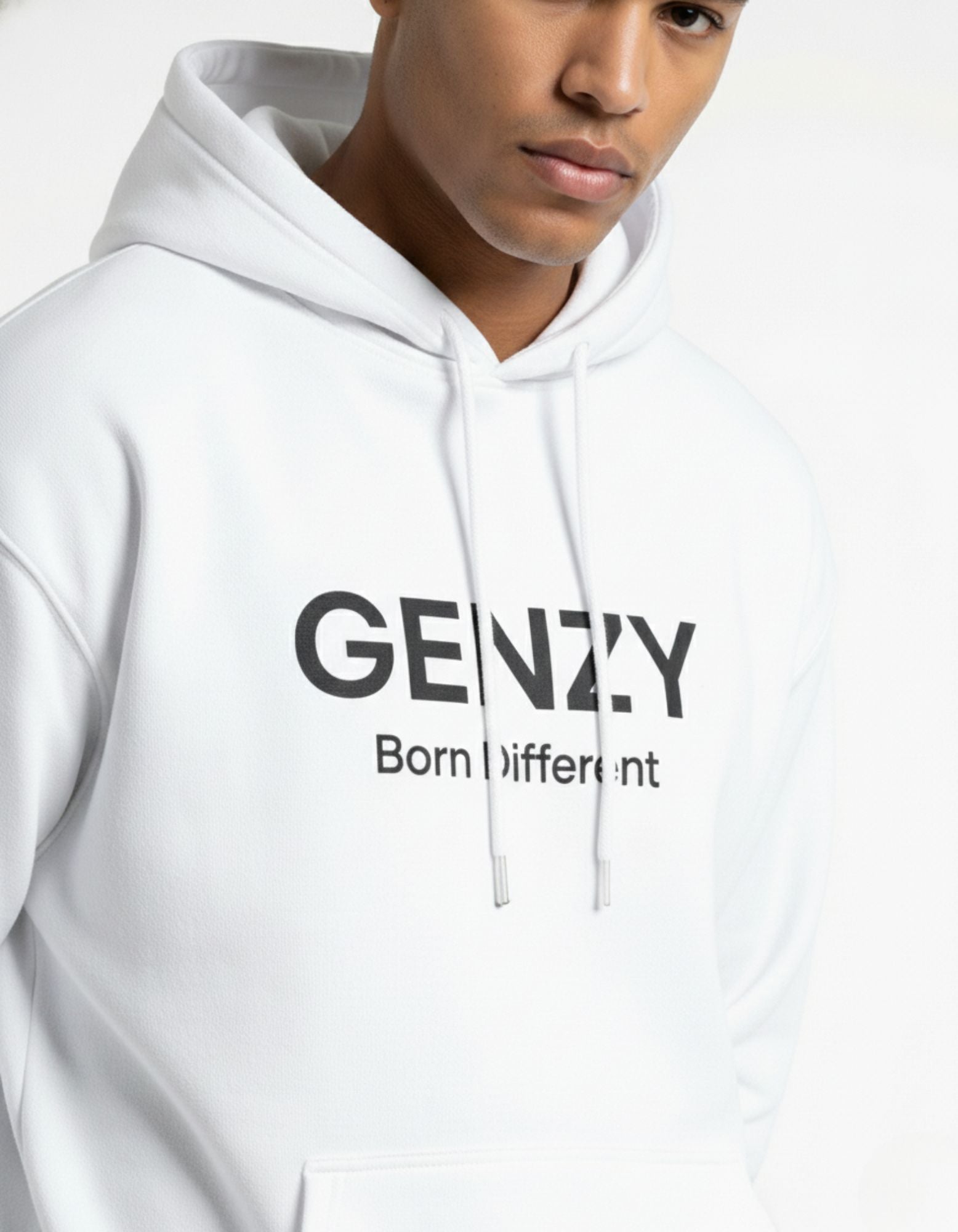 Close-up of white GENZY Born Different oversized hoodie featuring high-quality black puff print for streetwear enthusiasts.