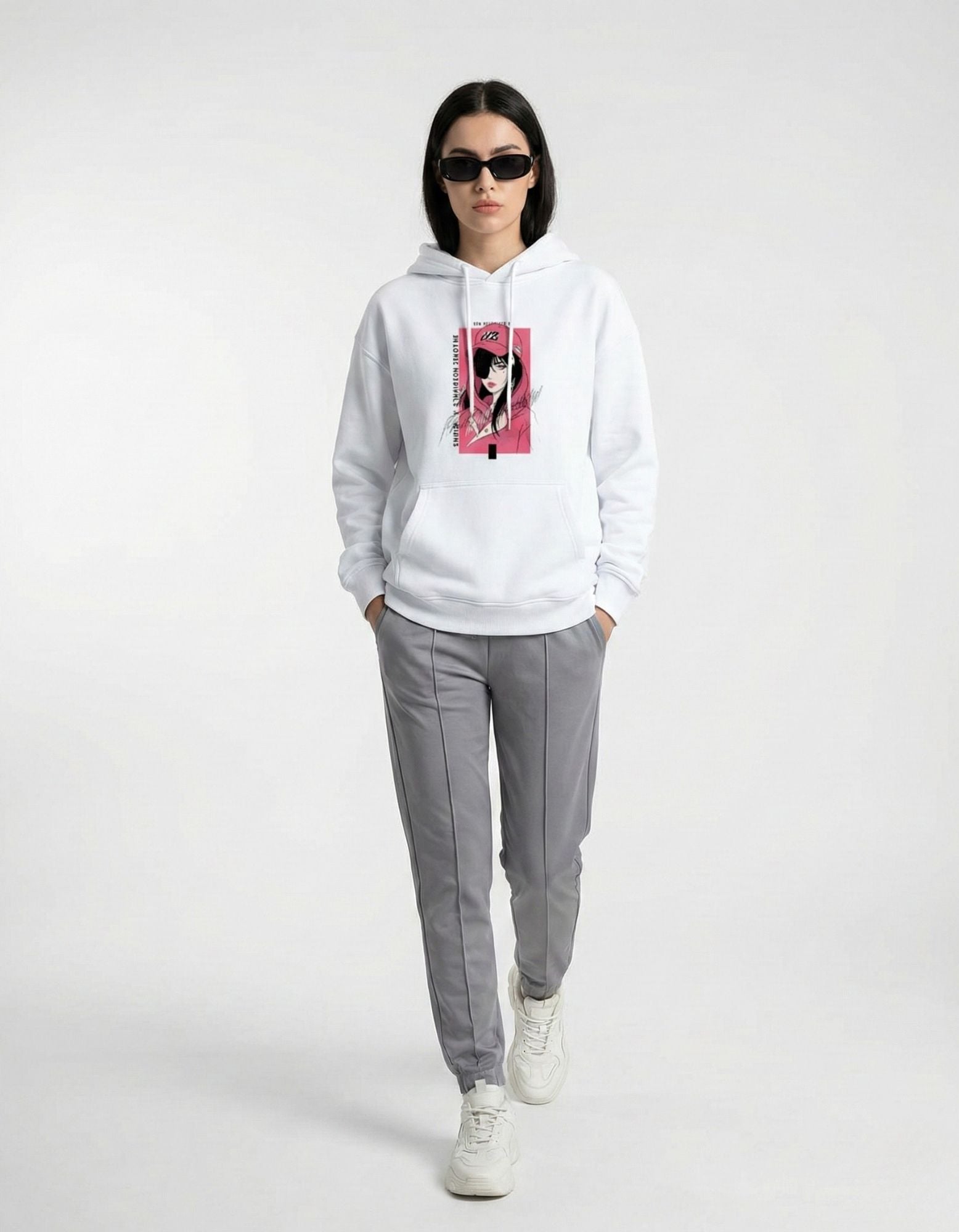 White oversized hoodie with anime graphic print worn by female model

