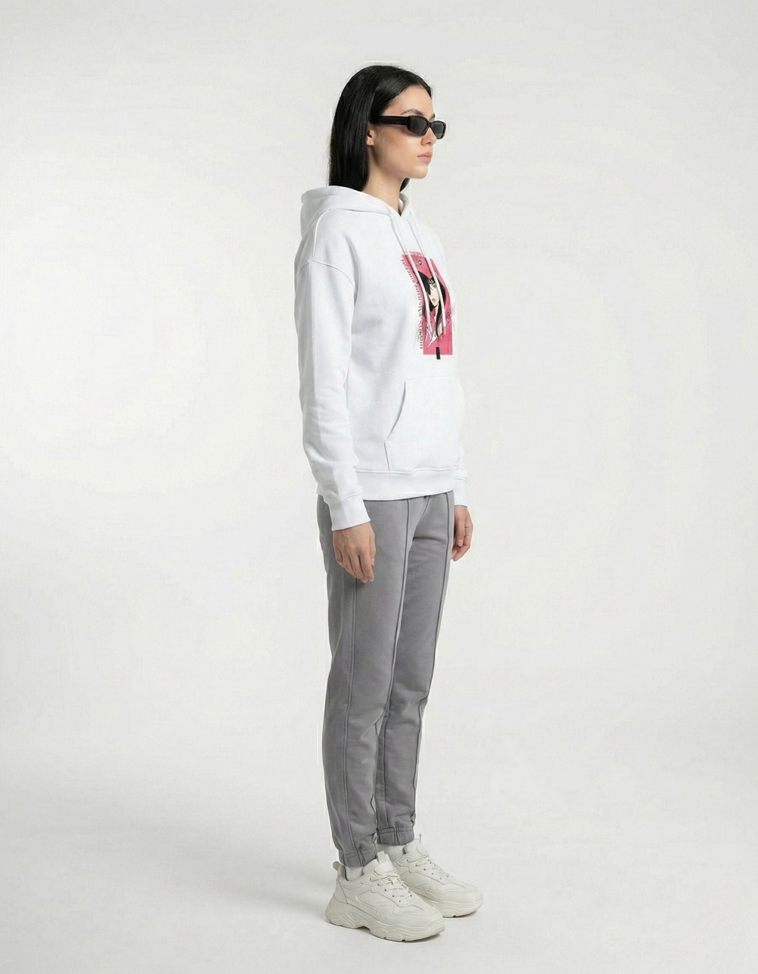 Side view of white oversized hoodie showing relaxed oversized fit
