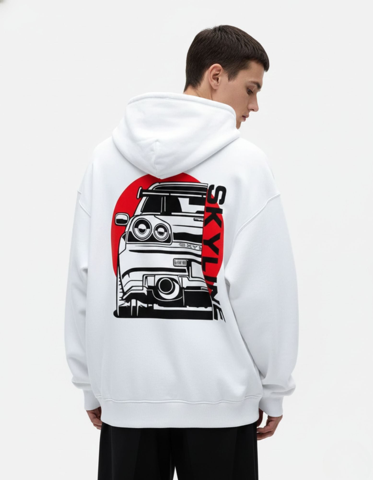 "Back view of a white heavy-cotton hoodie featuring a black Nissan Skyline R34 graphic with a red Japanese sun background."