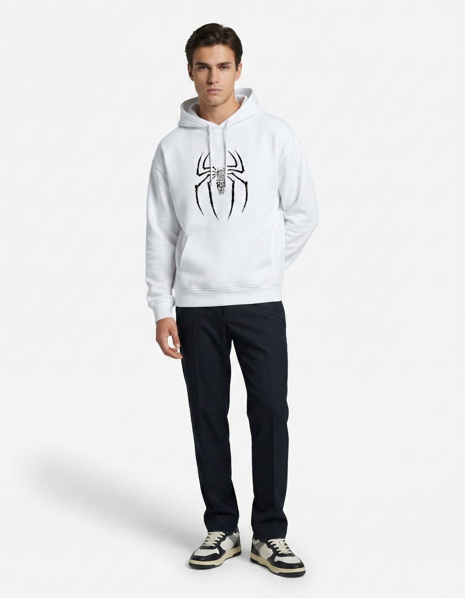 Full-body shot of a male model in a GENZs Fashion white spider graphic hoodie paired with navy trousers.