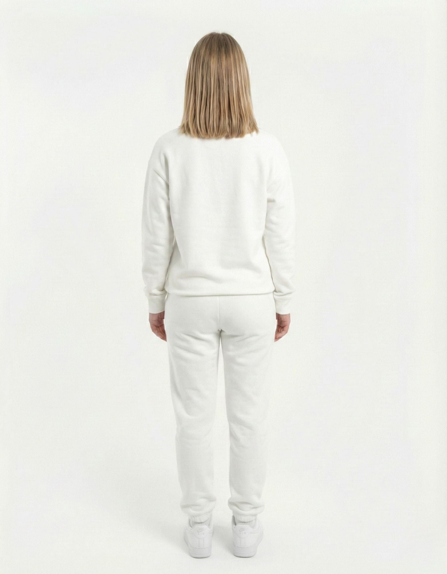 Rear view of a high-quality white unisex crewneck sweatshirt, highlighting the clean fit and breathable fabric.