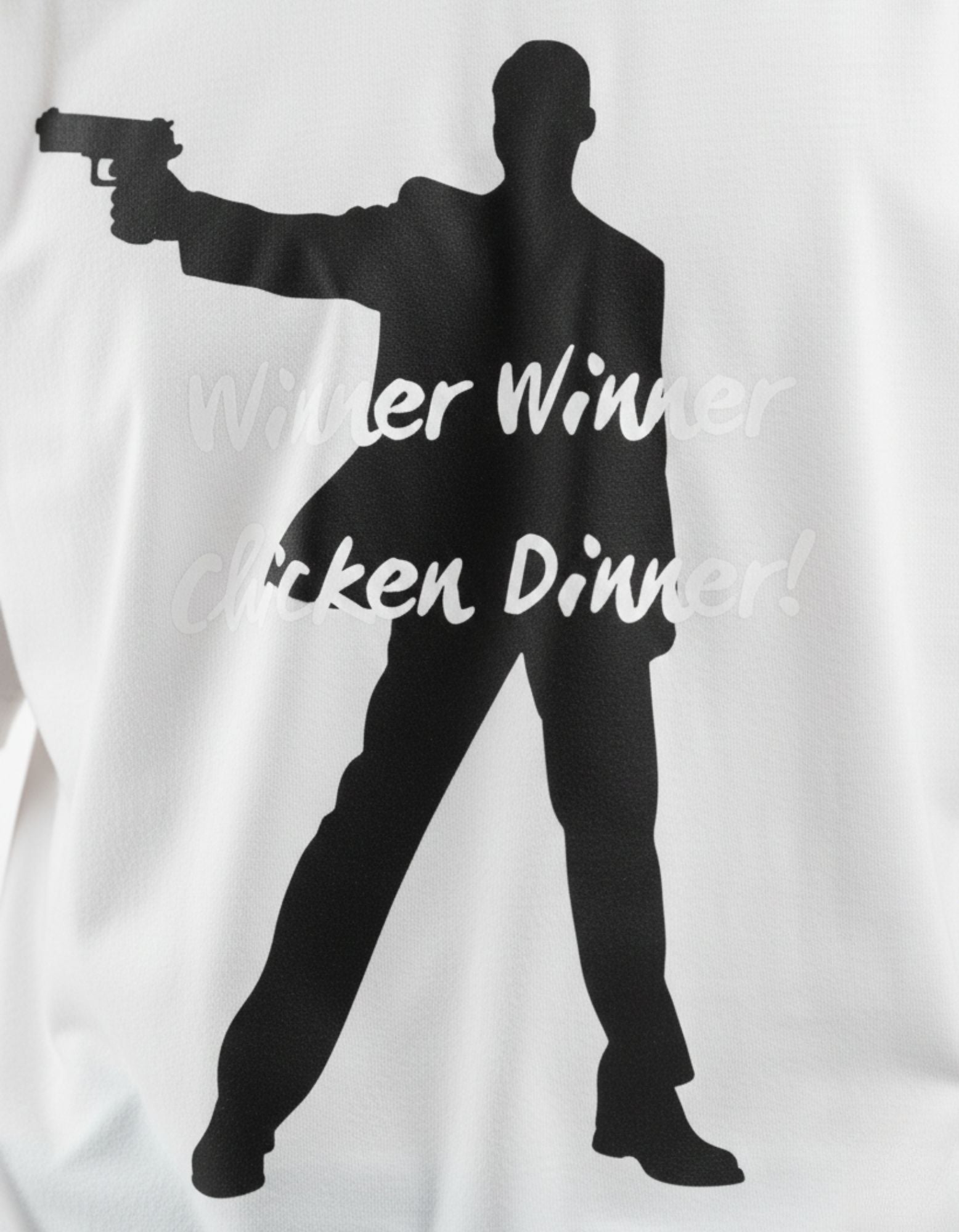 Close-up of "Winner Winner Chicken Dinner" silhouette graphic on a white GENZs Fashion oversized gaming t-shirt.