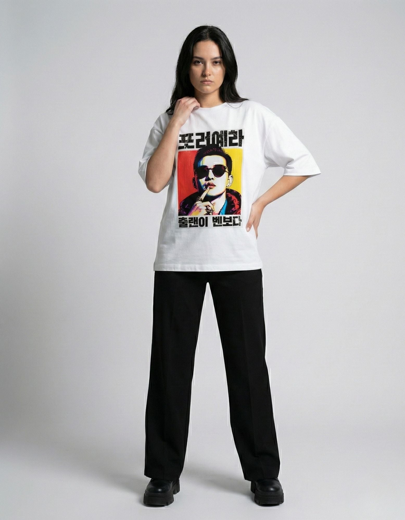 "Woman posing in a white oversized t-shirt with Korean graphic print, premium unisex streetwear India."