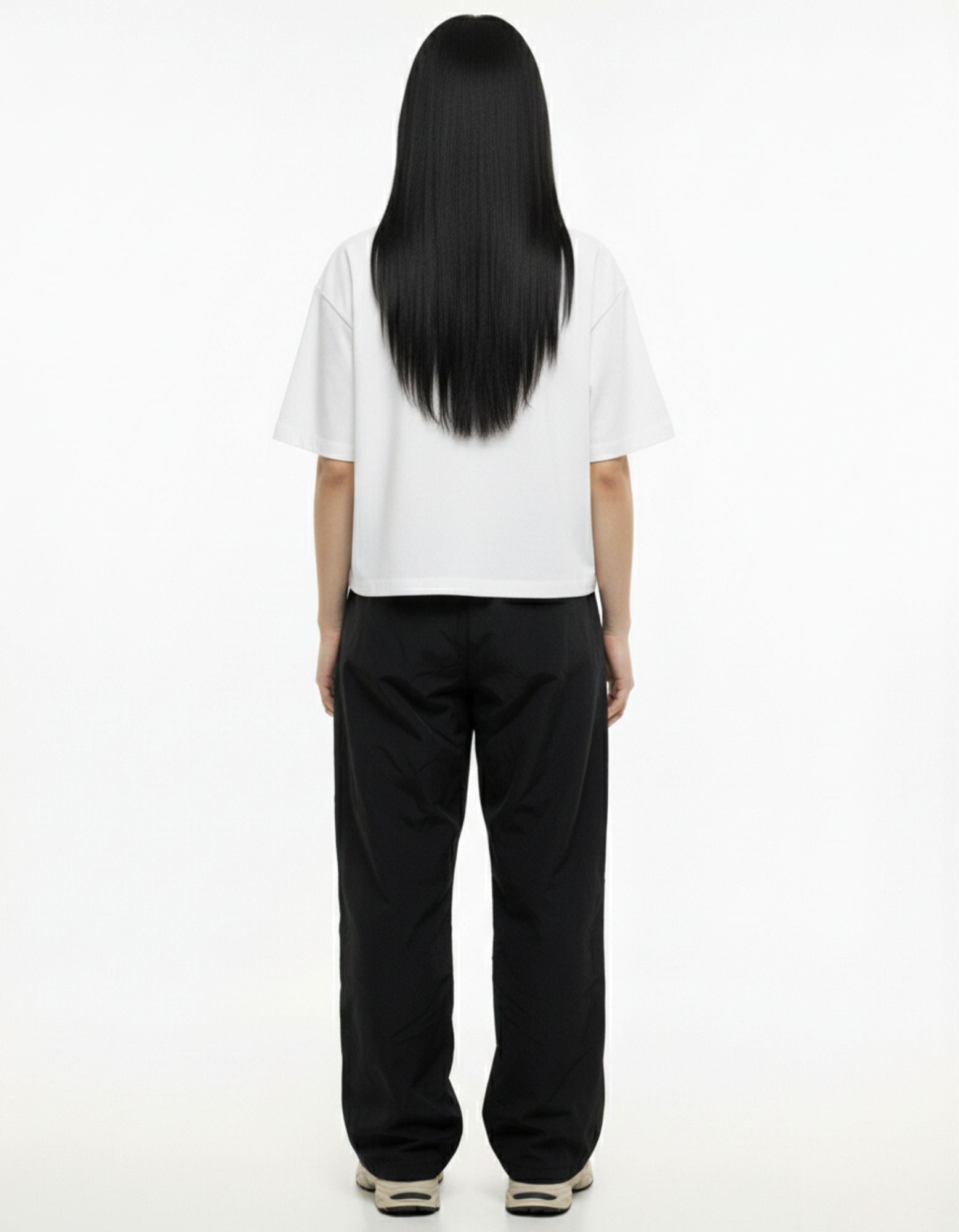 Back view of women's oversized white t-shirt, 100% cotton streetwear apparel India.