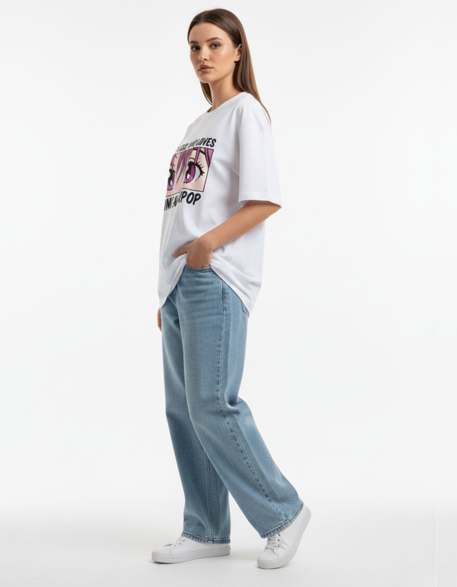 Side profile of a woman in a white baggy anime t-shirt and wide-leg jeans, aesthetic Gen Z outfit India.