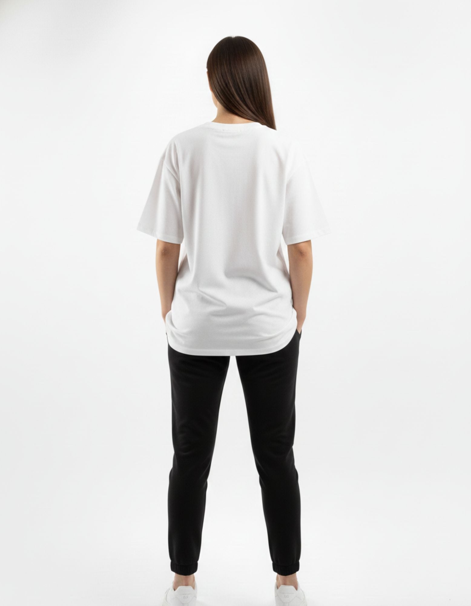 Back view of a white oversized t-shirt for women, showcasing the clean minimalist back and relaxed fit for daily wear.