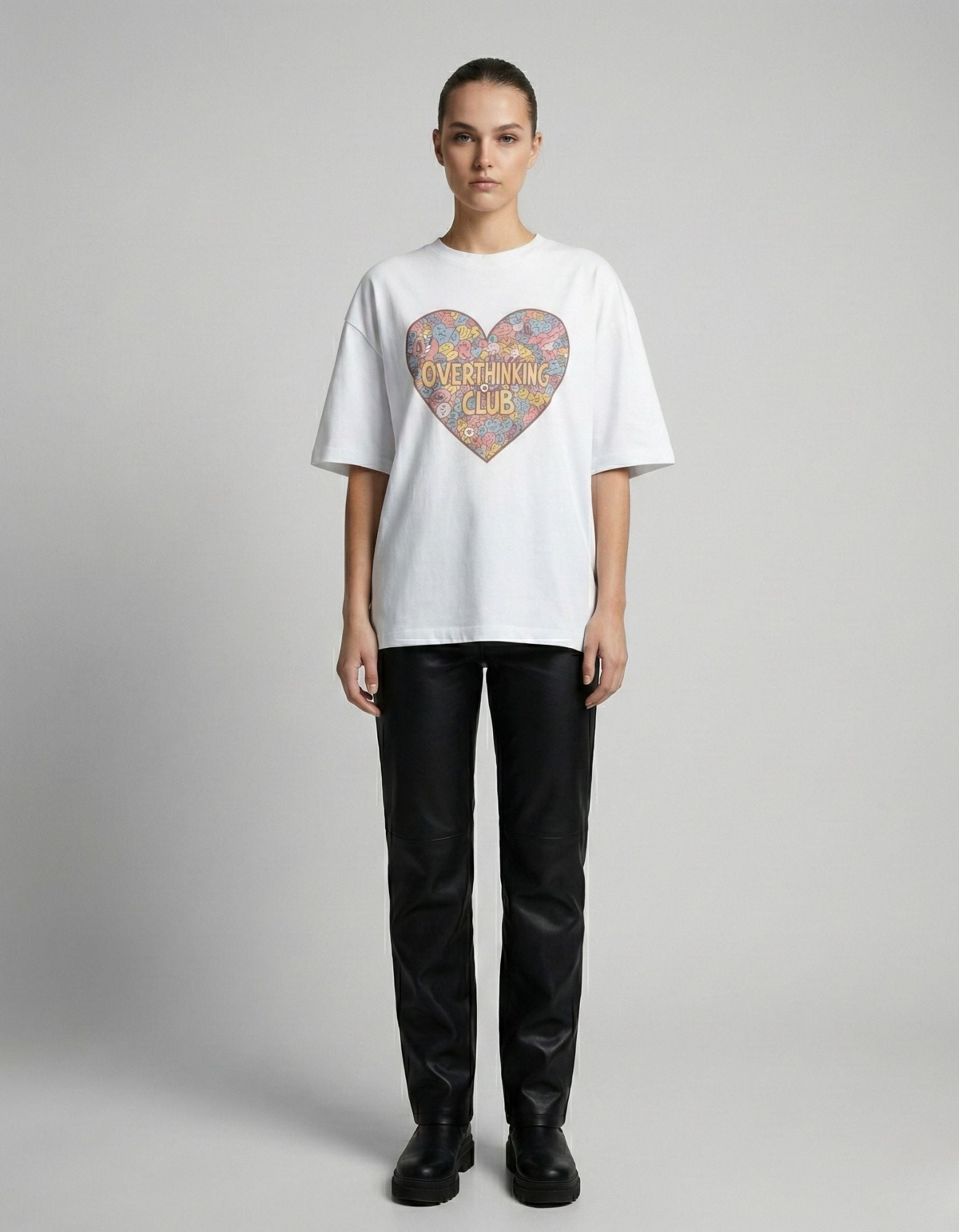 Straight front view of the "Overthinking Club" white t-shirt on a female model, perfect for the "oversized-core" fashion trend.