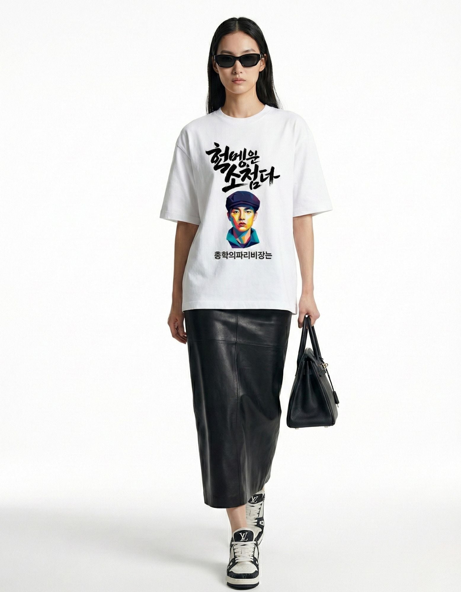 "Front view of female model wearing a white oversized t-shirt with Korean graphic, stylish streetwear for women."