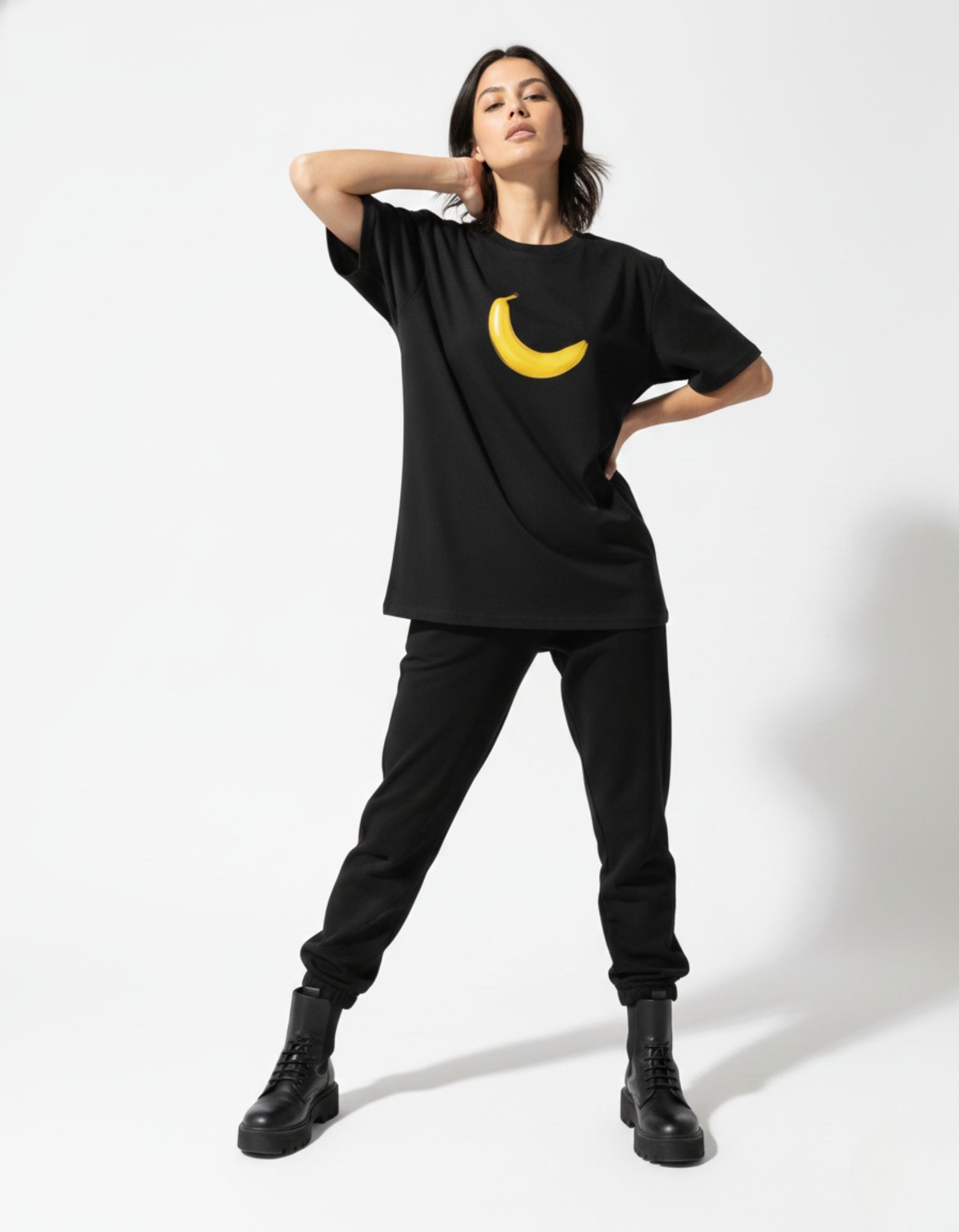 Women's GENZs Fashion oversized black t-shirt with a quirky yellow banana graphic for urban style.