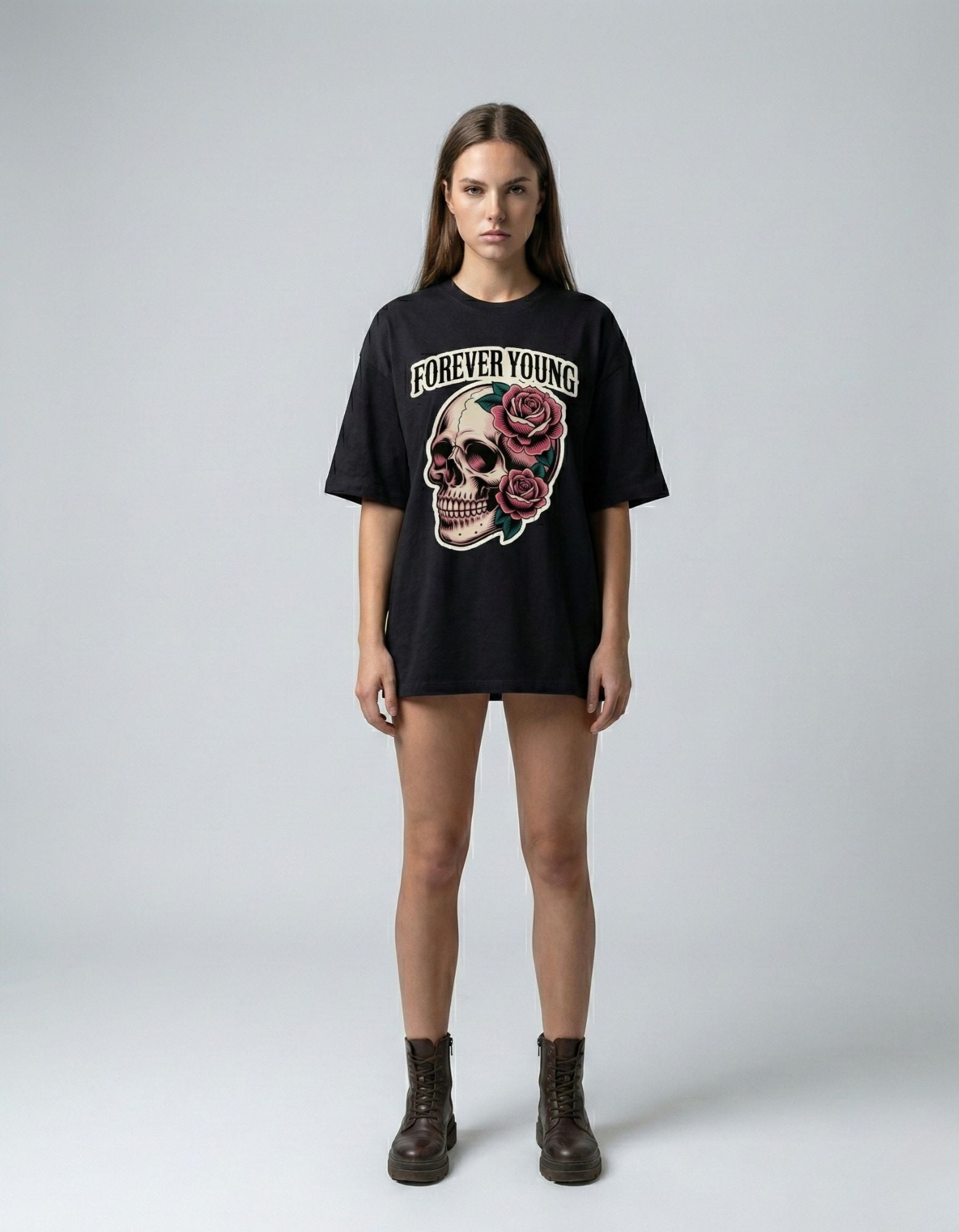 Woman in a black oversized graphic t-shirt featuring skull and rose design, Gen Z aesthetic India.