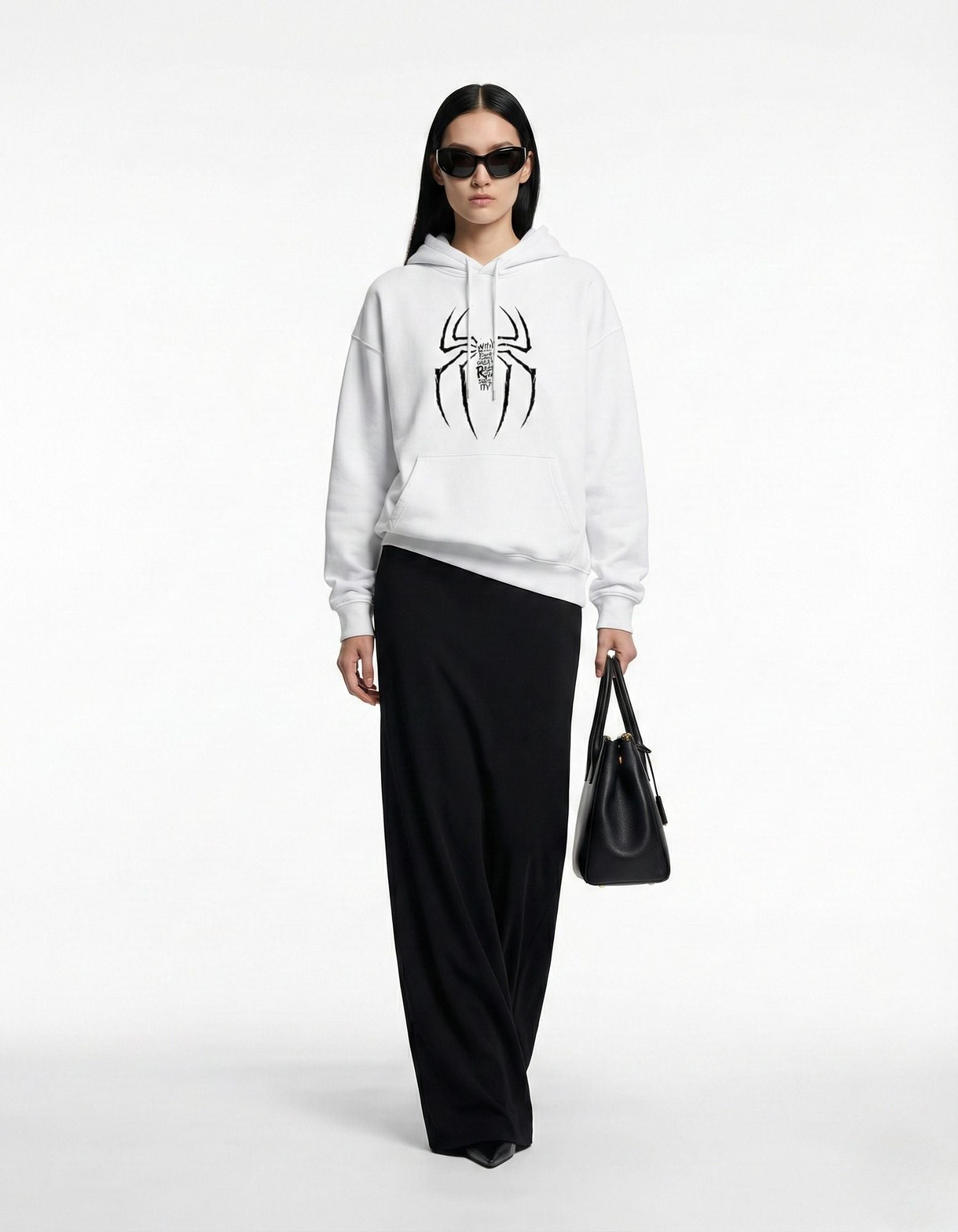 Front view of a female model wearing a white GENZs Fashion hoodie with a spider graphic and iconic quote text.